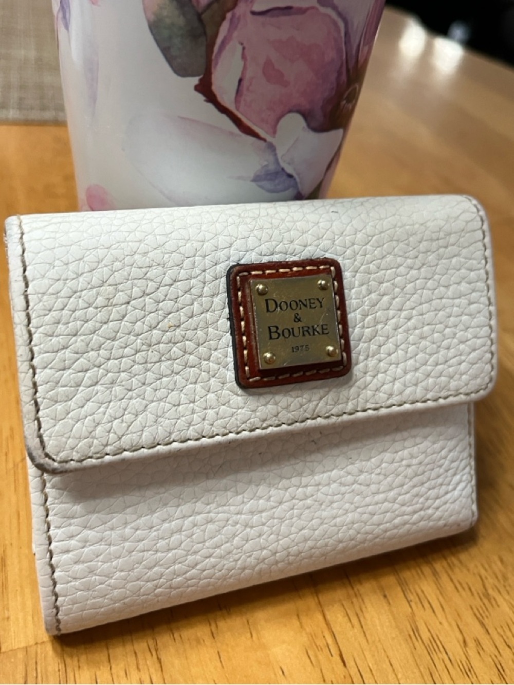 Dooney & Bourke White Pebbled Leather Bifold Wallet with Gold Plaque